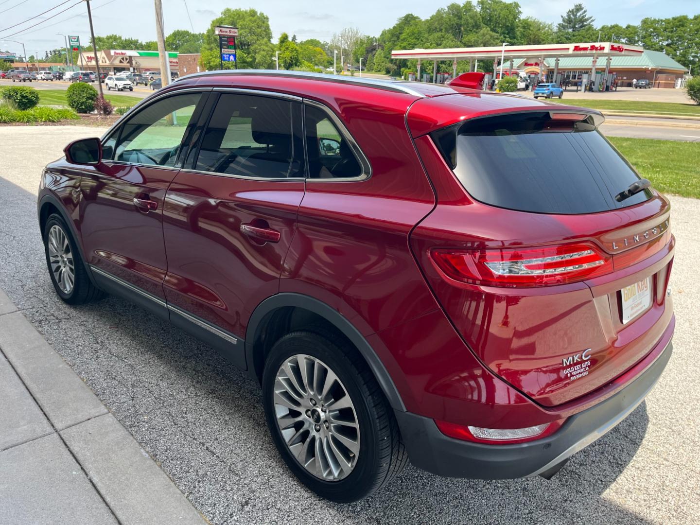 2015 Ruby Red Met Tinted CC Lincoln MKC AWD (5LMCJ2A92FU) with an 2.0L L4 DOHC 16V engine, 6-Speed Automatic transmission, located at 1633 W Kimberly, Davenport, IA, 52806, (563) 323-5341, 41.559456, -90.598732 - Photo#3